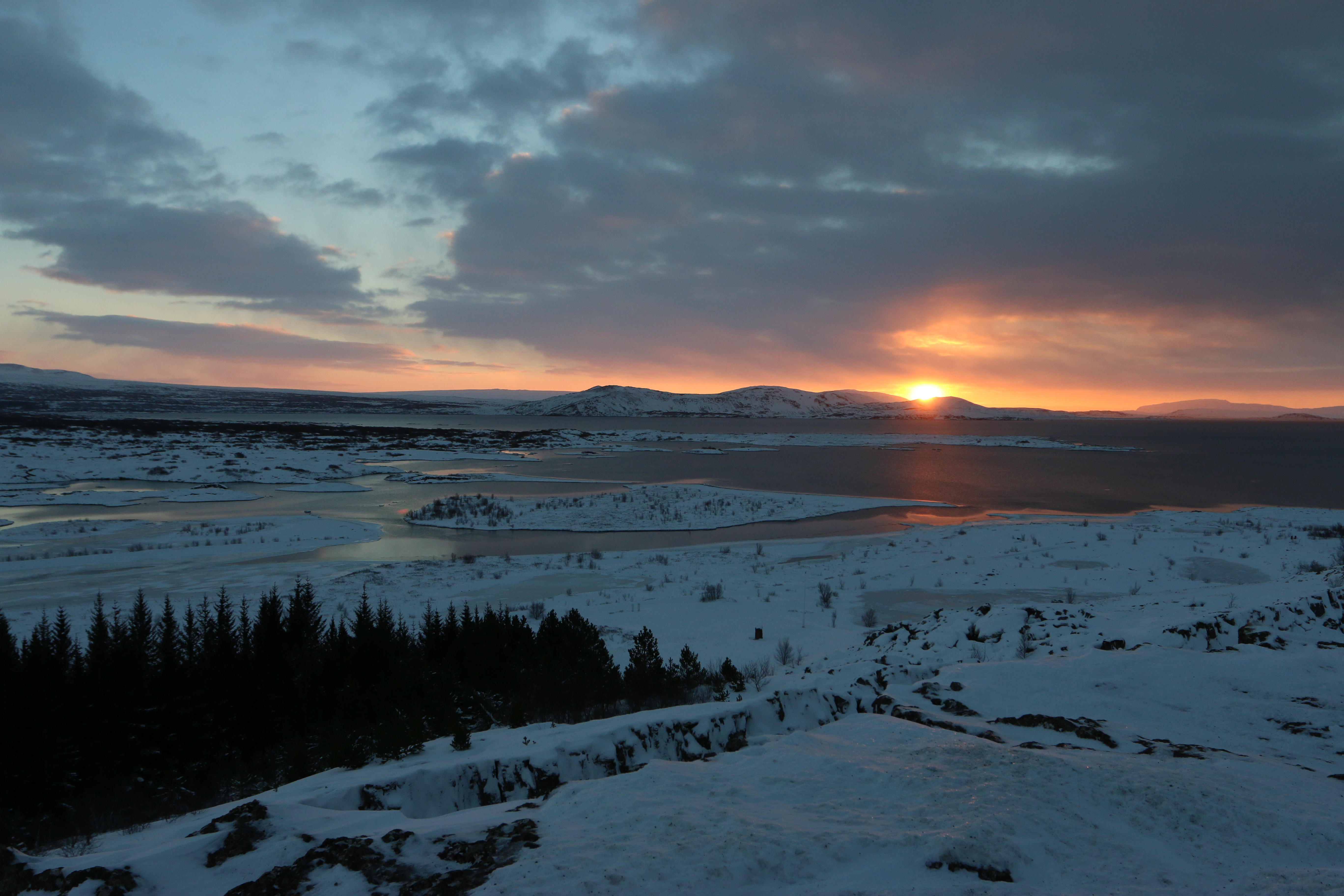 Like a moody teenager, the sun rises at noon over þingvellir National Park in Iceland, December 2014.